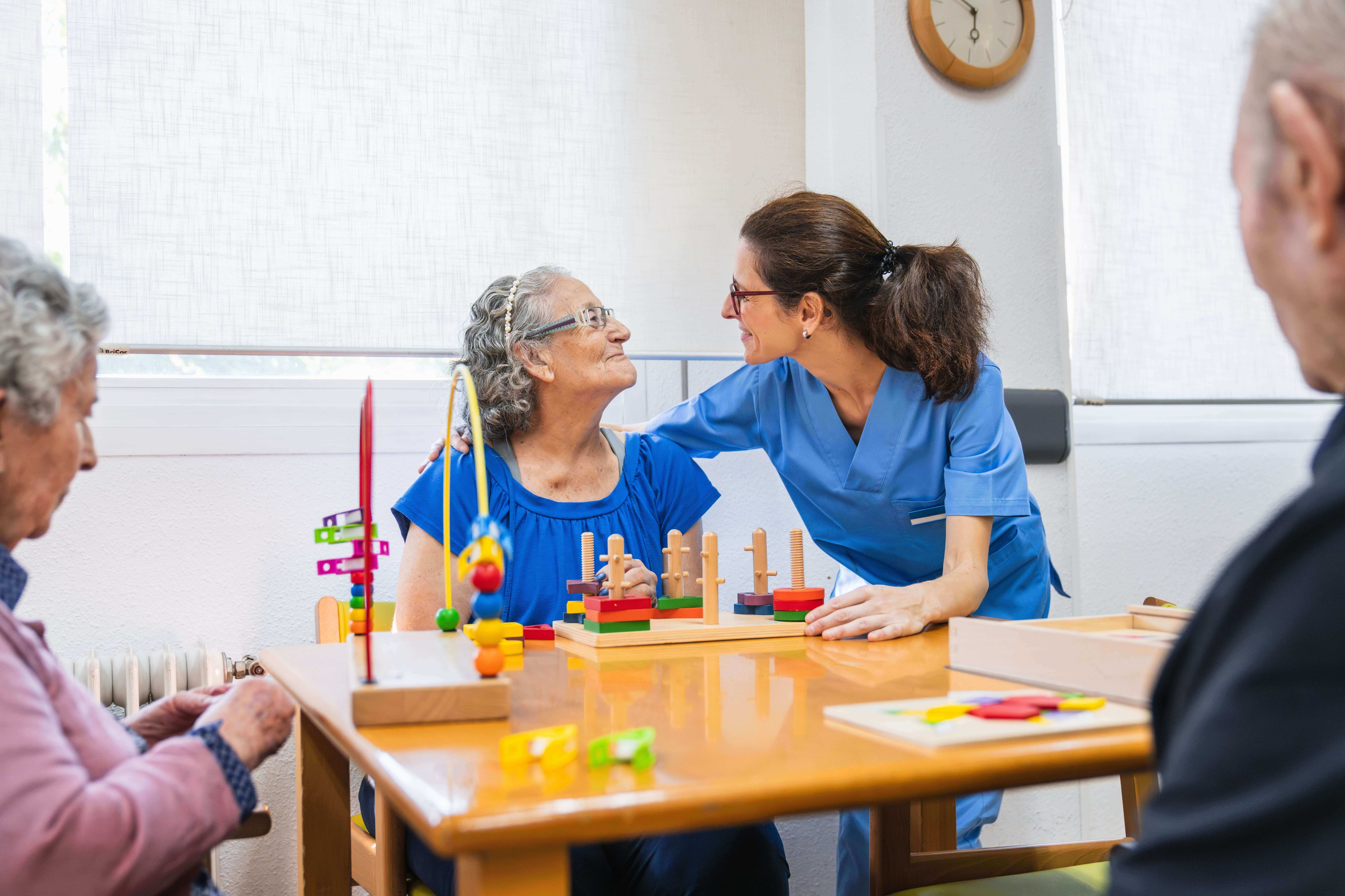 Nurse helping an elderly woman
